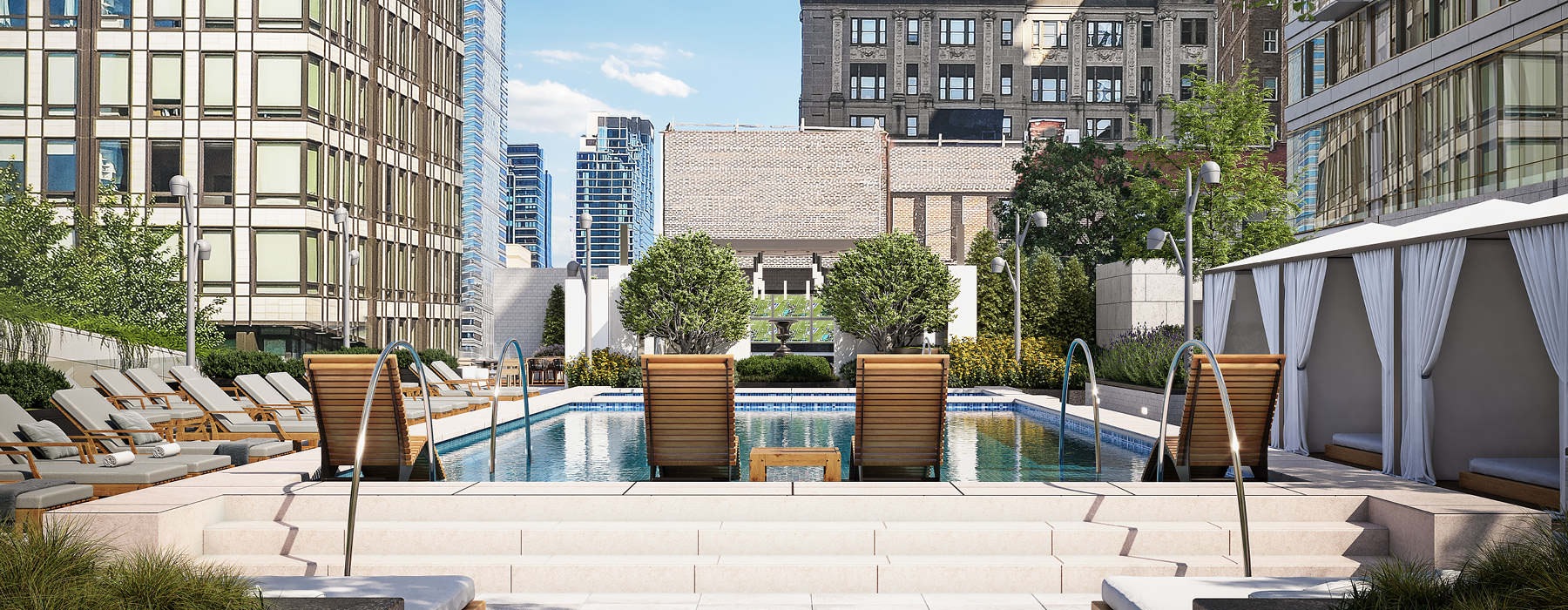 city views from beautiful rooftop pool with lounge chairs
