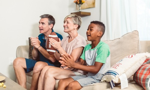 Family Watching Football on Television